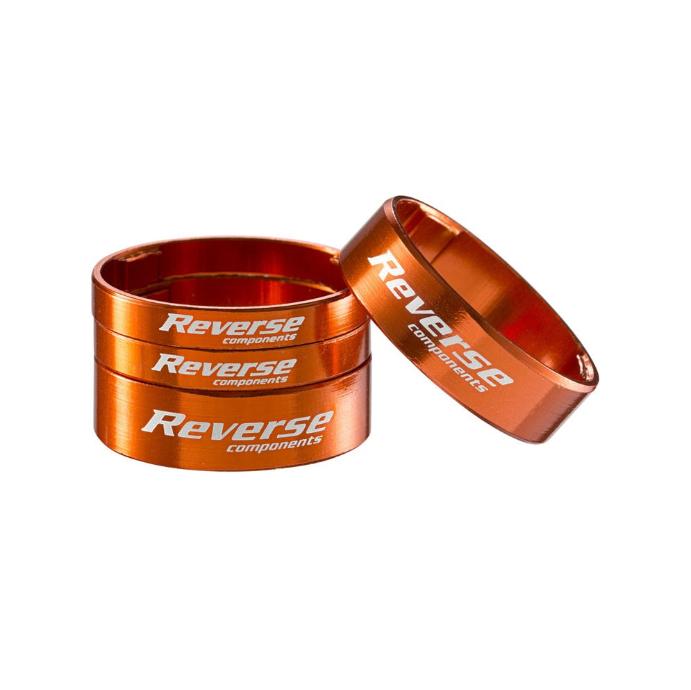 Zestaw podkładek rozdzielających układu kierowniczego REVERSE COMPONENTS z ultralekkiego aluminium 1"1/8, kolor pomarańczowy