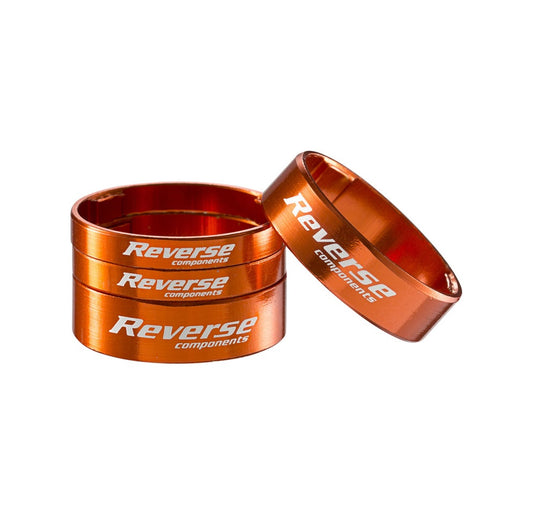 Zestaw podkładek rozdzielających układu kierowniczego REVERSE COMPONENTS z ultralekkiego aluminium 1"1/8, kolor pomarańczowy
